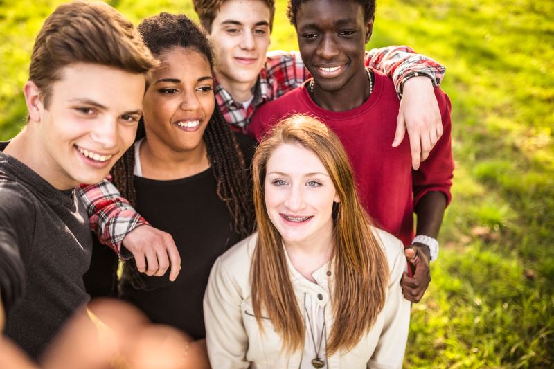 Group of teens taking a selfie.
